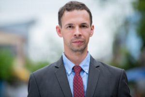 Businessman wearing suit in the streets outdoors